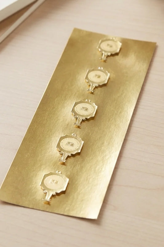 Pack of Gold Foil Emblem Stickers